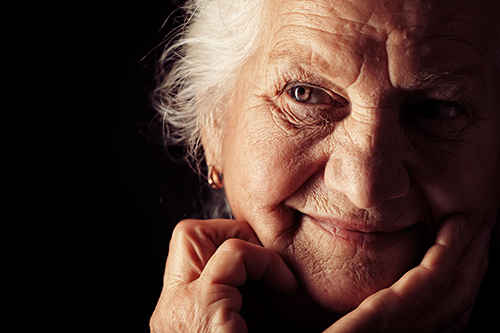 Close up of elderly woman with brown eyes